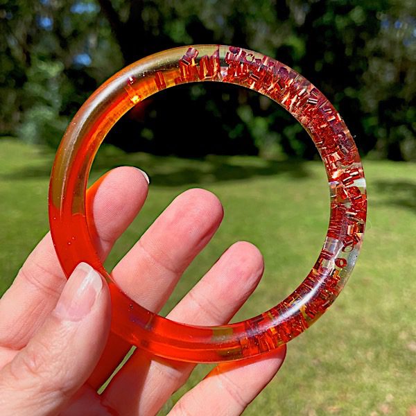 orange-resin-bracelet-with-glitter