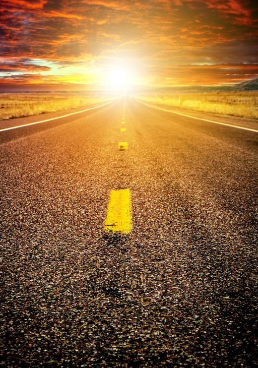 sun-shining-on-asphalt-road