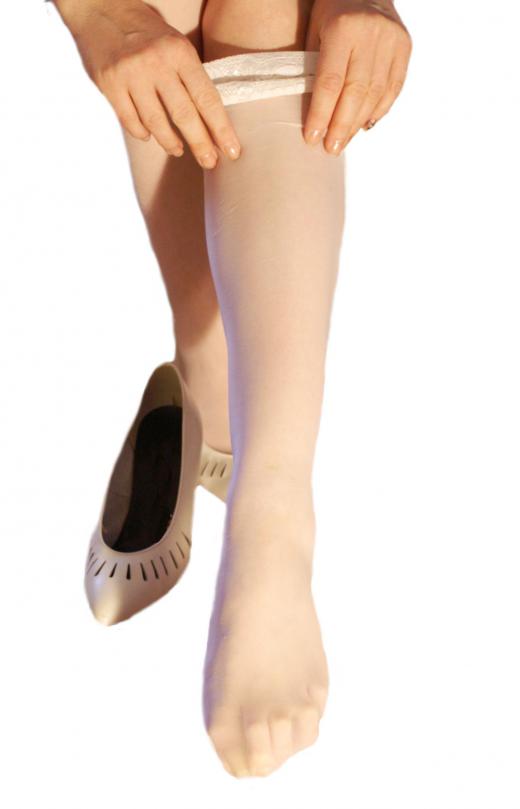 woman-putting-on-white-stockings