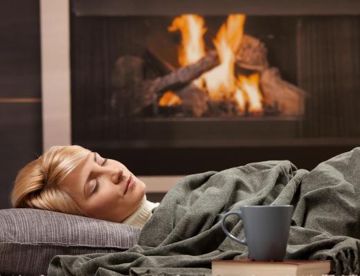 woman-resting-near-fireplace