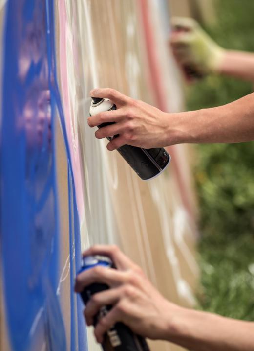 hands-doing-graffiti