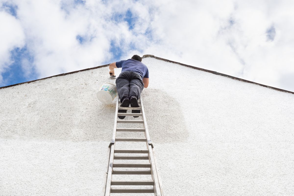 painting-gable-end-of-house-with-ladder