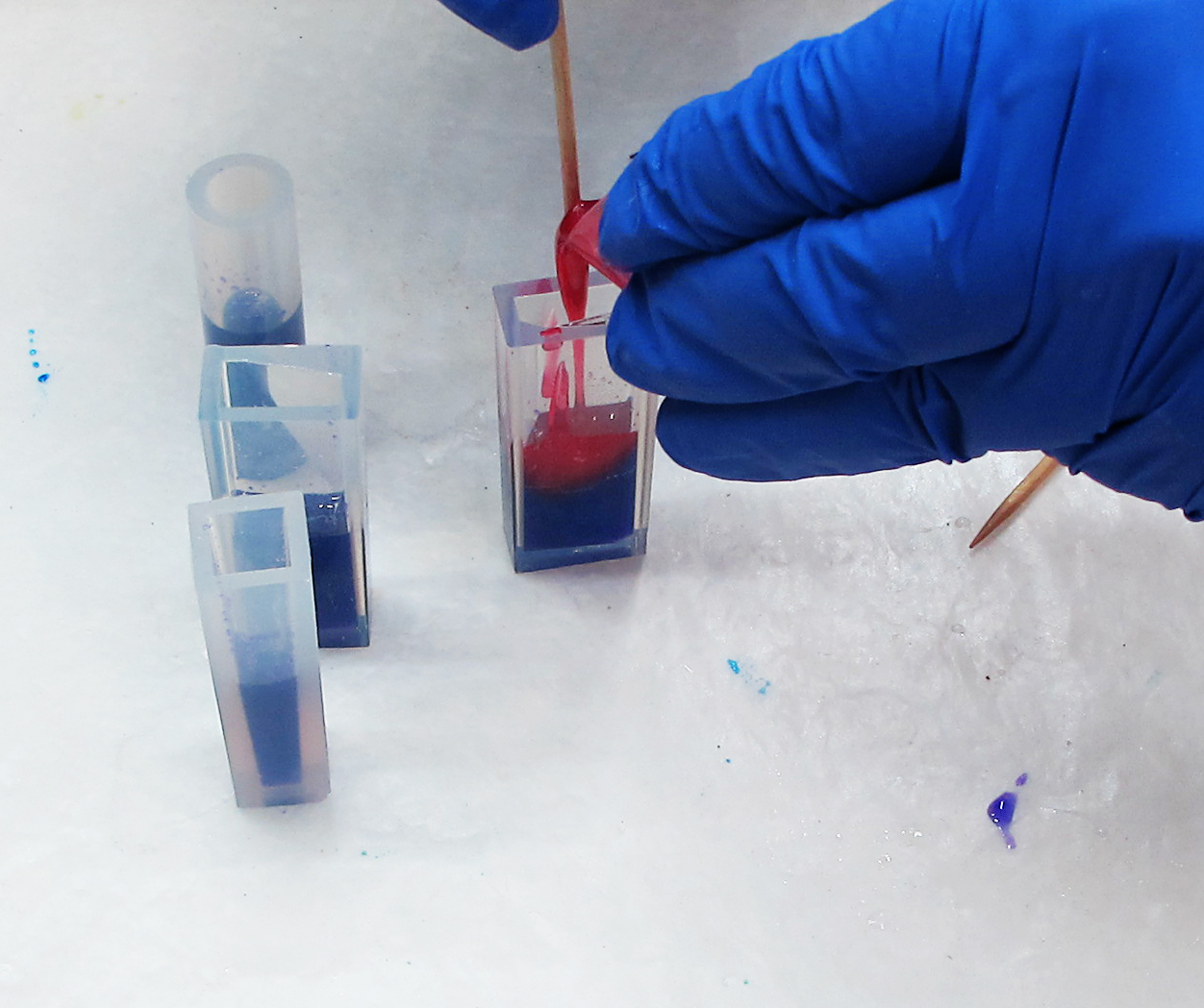 pouring-a-second-colored-layer-of-resin-into-a-mold